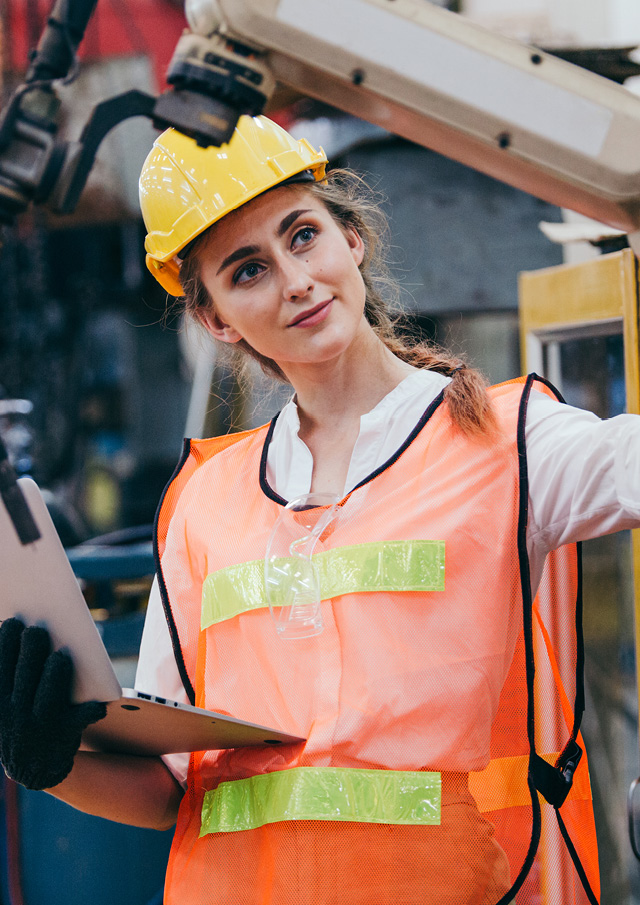 Construction worker wearing a high vis top and a hard hat. 